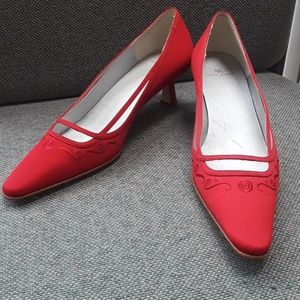 Red satin pumps